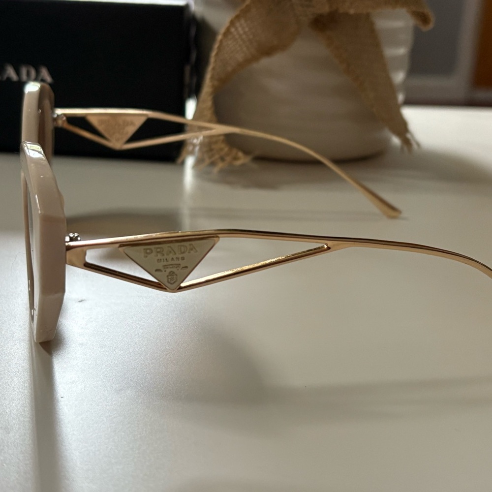 Prada Women's Sunglasses with Gold Frame